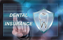 person pointing at dental insurance logo