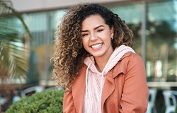 Smiling woman sitting outside