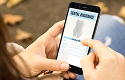 Patient reviewing dental insurance coverage for implants