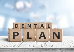 “Dental plan” written on wooden blocks, sitting on tabletop