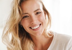 Closeup of woman with blonde hair smiling 