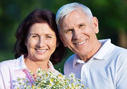 An elderly couple smiling