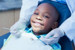 Boy smiles while visiting Bartlesville children's dentist