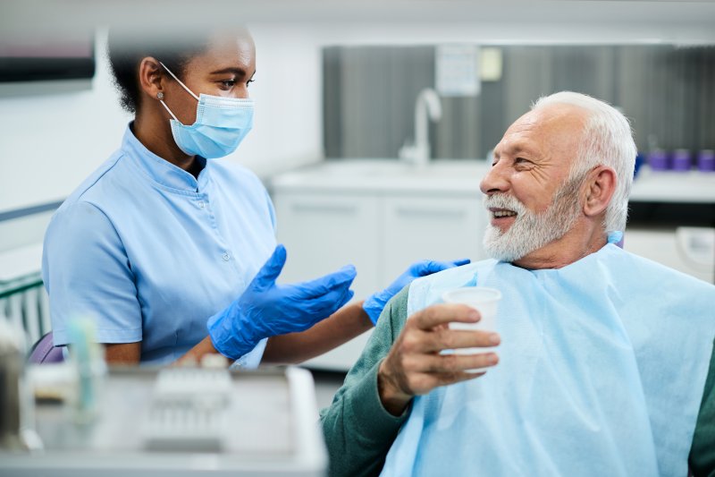 patient attending dental checkup with dentures