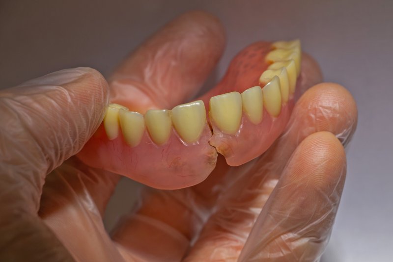 A set of dentures with a split down the middle