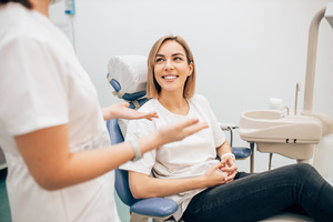 patient talking to their dentist