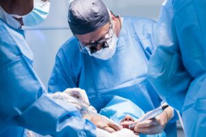 Dentists performing dental implant surgery.